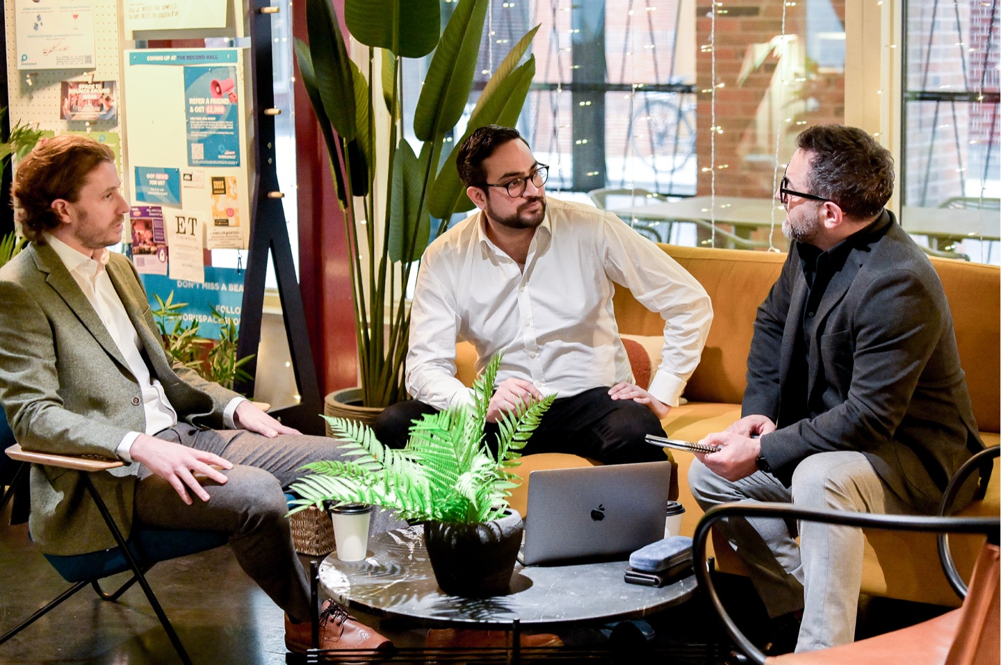 Three of the team talking through the roadmap over coffee
